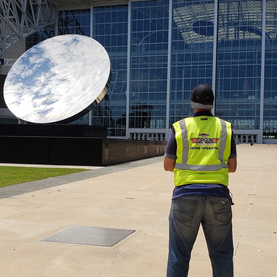 John Johnson operating drone at AT&T Stadium plaza in Arlington Texas